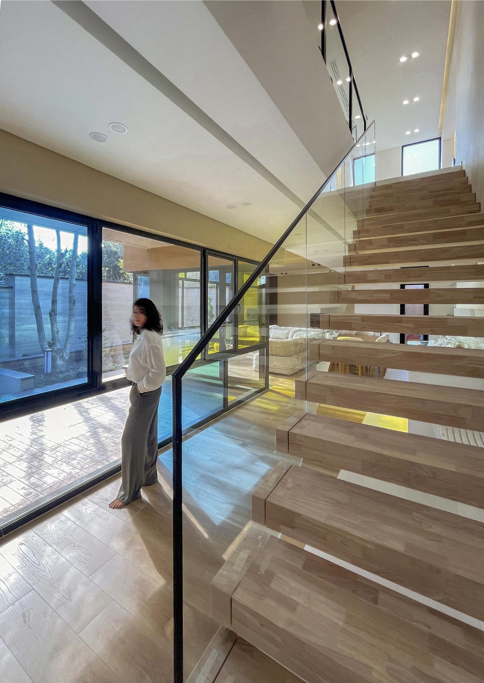 stairs and a window, Two Regions, a Villa.. An interwoven house